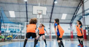 children playing basketball at