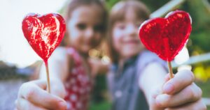 two children with lollipops