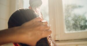 woman washing hair with